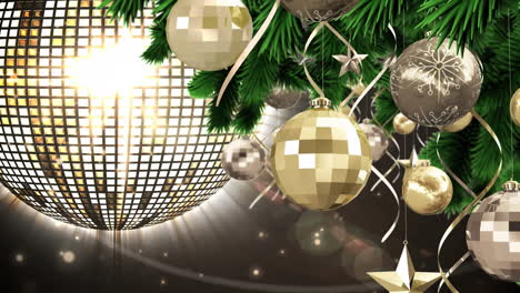 digital animation of christmas baubles and stars decorations hanging on christmas tree