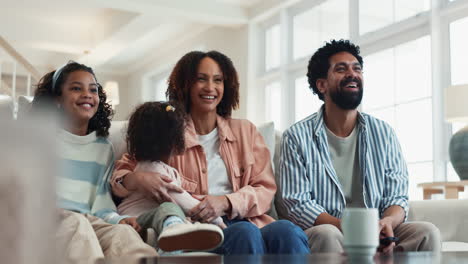 happy family watching tv together at home