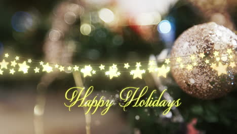 animation of happy holidays text over christmas tree decorations