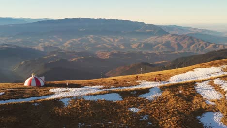 drone 4k clip of batrana mountain refuge high at 2170m in bucegi mountains, romania, on a beautiful autumn day