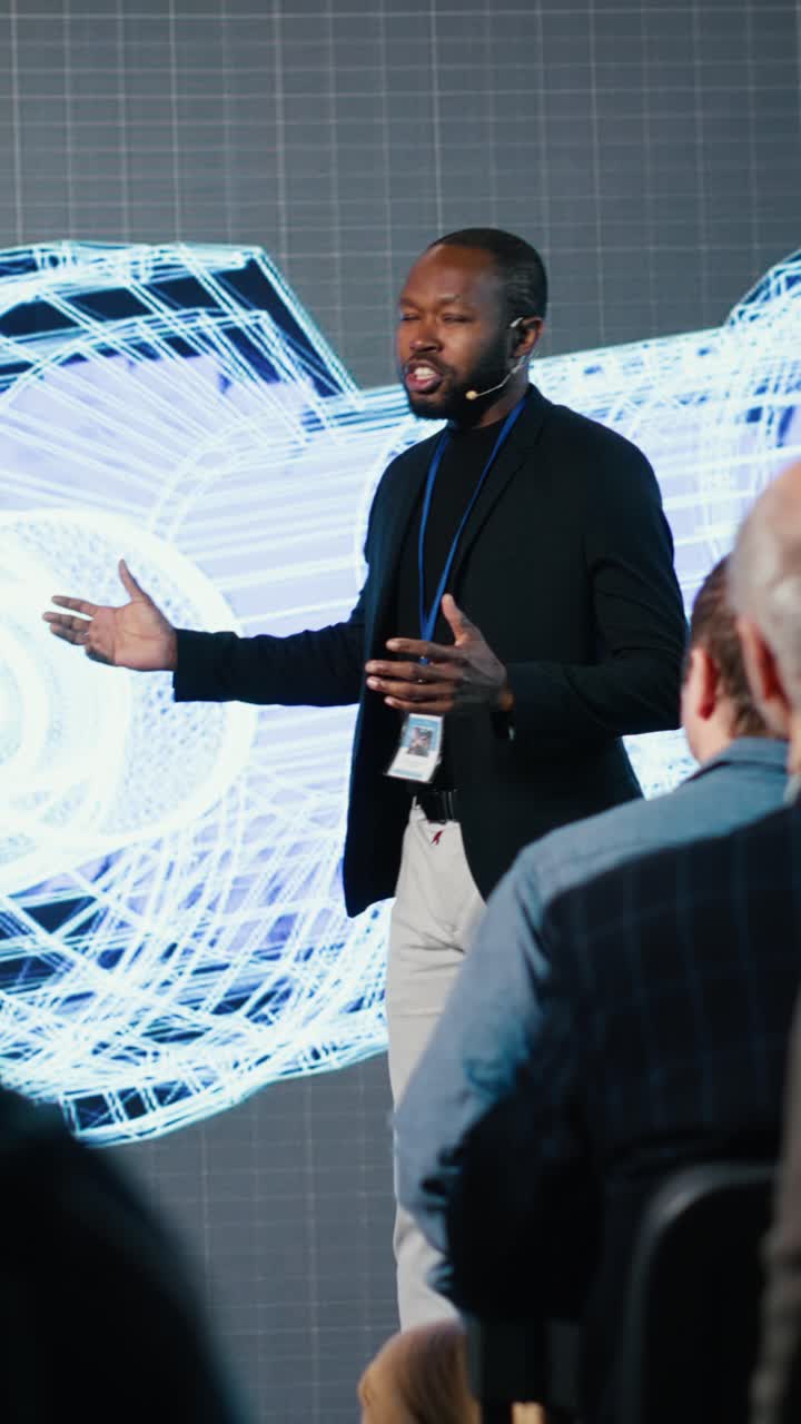 Vertical Video African american speaker does futuristic industrial presentation with a turbine