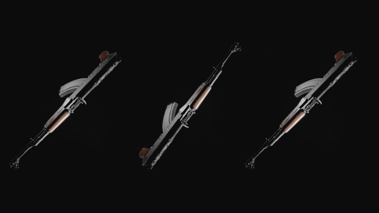 Machineguns on the dark background rotate in slowmotion