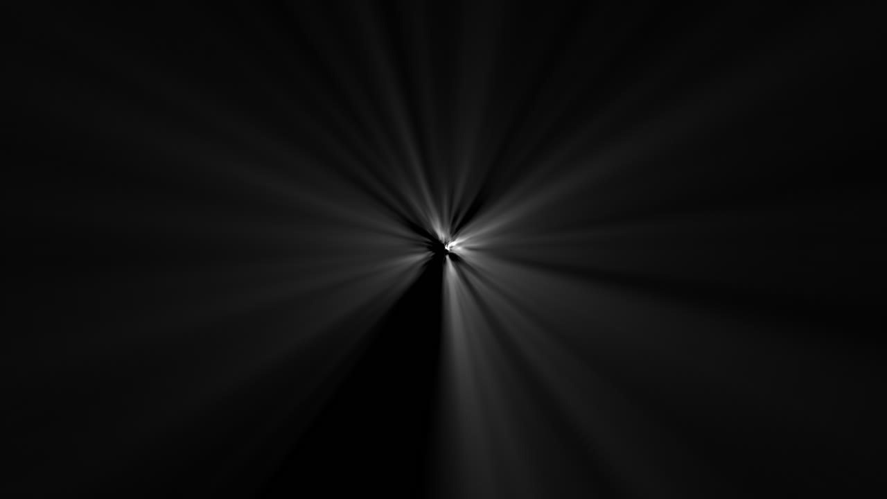 Light rays shining through darkness