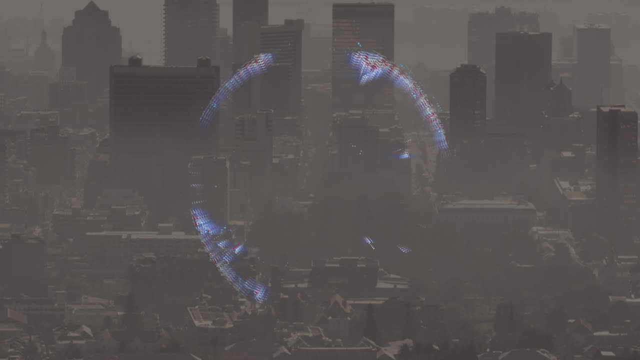 Animation of spinning globe icon against aerial view of cityscape