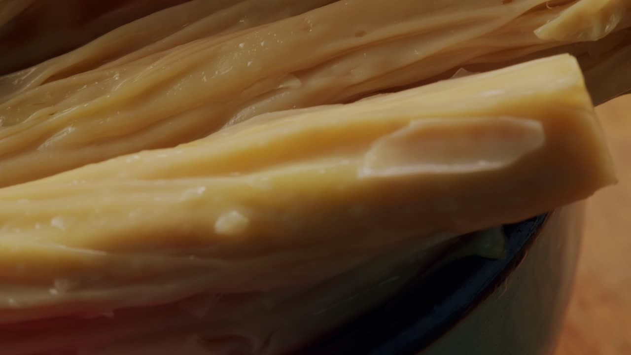 Fermented soy food Fuzhou, Tofu skin yuba sticks or Fuzhu on plate. Healthy asian soy food, Korean and Chinese cuisine.