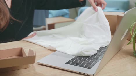 young asian transgender woman business owner with boxes on the table happy online sales job, get an order from customers, packing box delivery products to customers