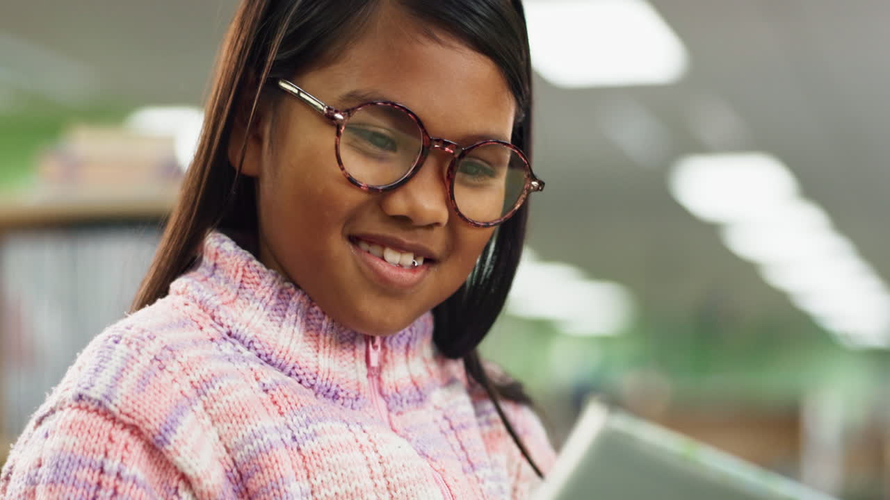 Girl reading in a library