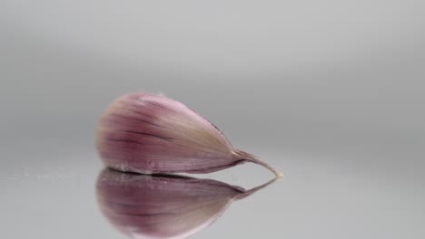 garlic clove on rotating plate, closeup studio shot