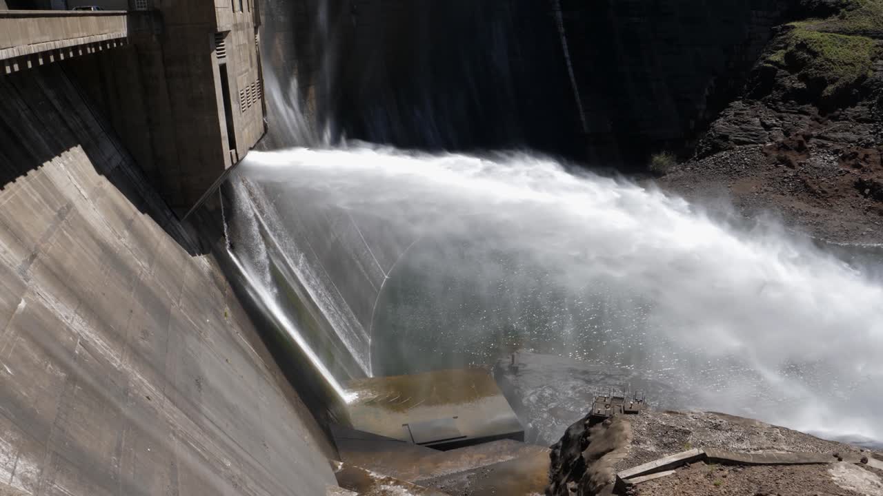 Water released from hydro dam falls in collection pool below dam wall