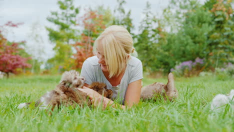 Woman-Playing-With-Litter-of-Puppies