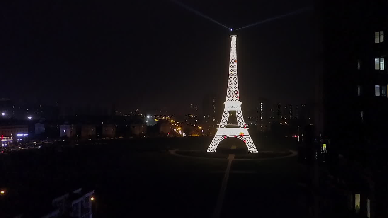 Replica Eiffel Tower light show at night in Tianducheng city, China