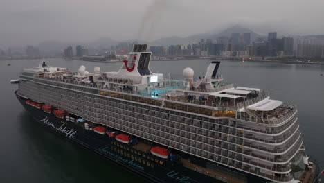 mein schiff 5 cruise ship operated by tui arriving in hong kong at dawn