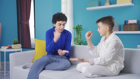 Two-young-boys-betting-and-playing-games-at-home.