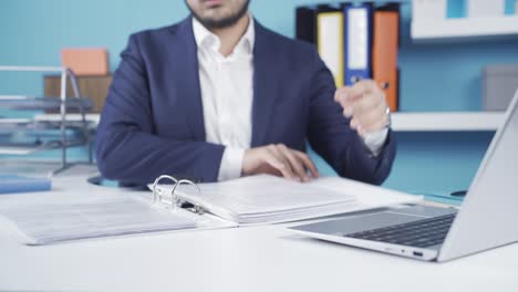 successful businessman is working analyzing paperwork.
