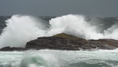 stormy waves crashing and spraying over cape of good hope reef