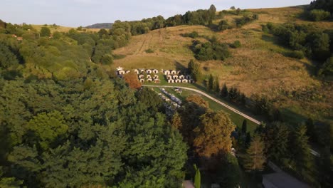 flyover above small cemetery, mausoleums near varbo, hungary at sunset