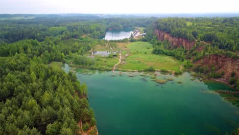 Grodek-Park-offers-a-picturesque-landscape-with-lush-greenery-and-turquoise-water-in-Jaworzno,-Silesian-province