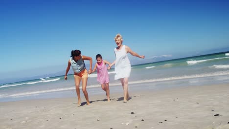 Multi-generation-family-enjoying-at-beach