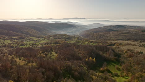 misty mountain valley landscape with autumn colors