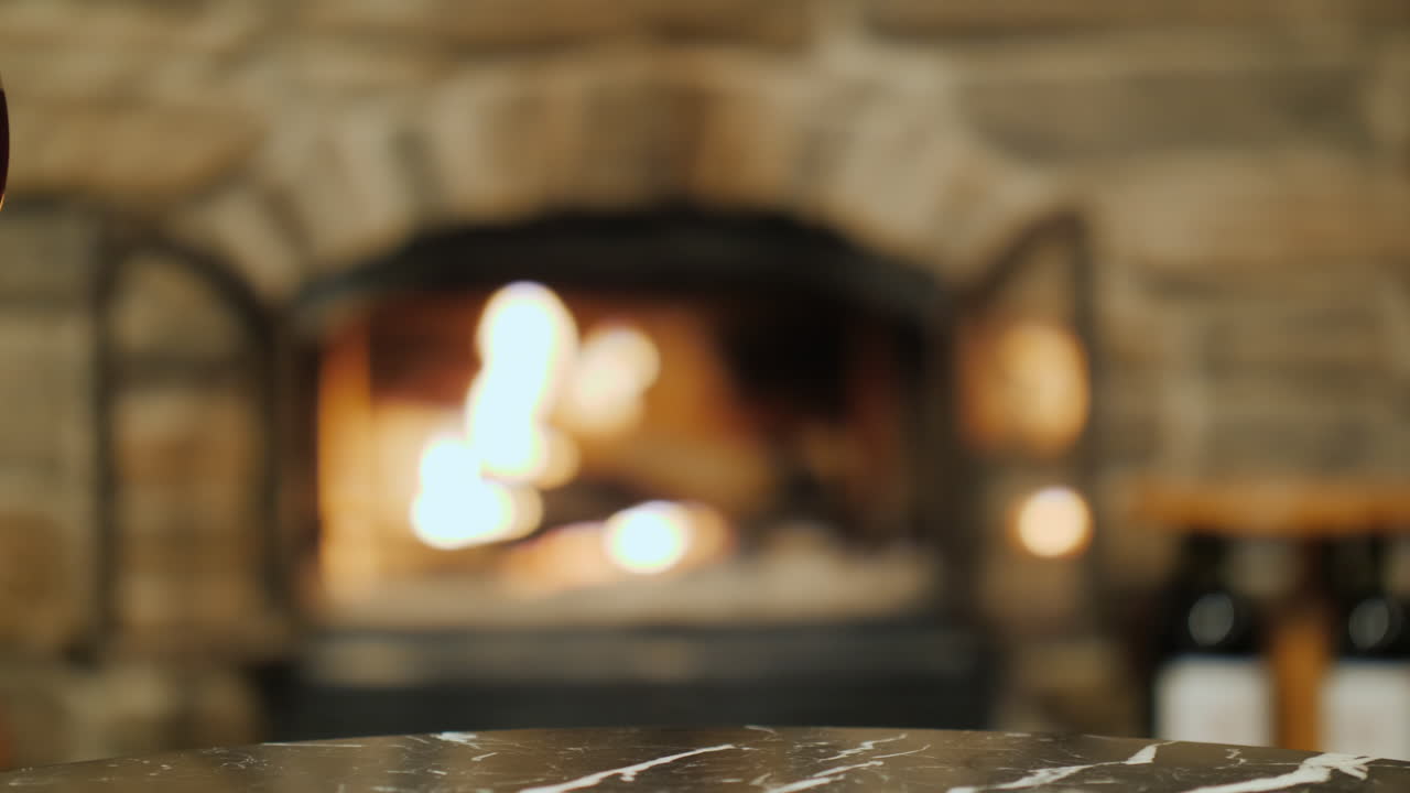 Toasting With Red Wine by Fire