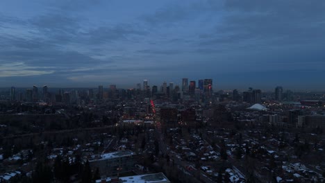 drone flight of downtown calgary during blue hour