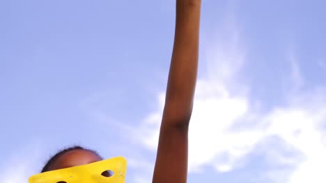 boy pretending to be a super hero