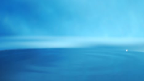 video de 4k de una mano humana de primer plano tocando la superficie del agua con un dedo.