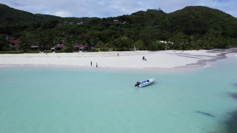 boat parked by beach in seychelles