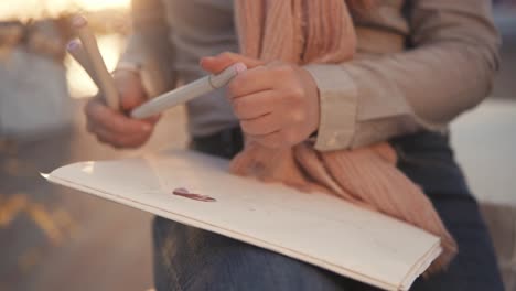 woman drawing outdoors