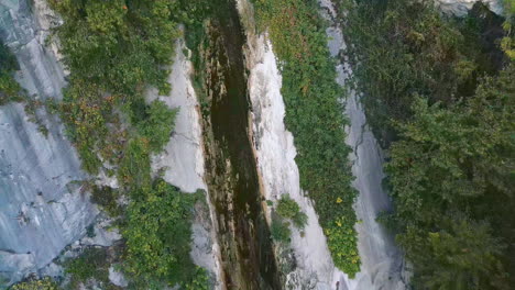 Aerial-top-view-of-a-crack-in-a-cliff