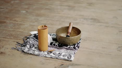 Close-up-view-of-Tibetan-wooden-melody-bell-and-singing-bowl-for-meditation-and-mindfulness-exercises