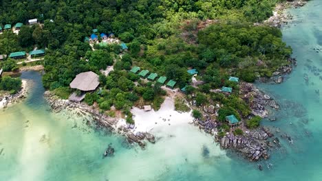 aerial establishing shot of private beach resort at island paradise in koh rong sanloem, cambodia