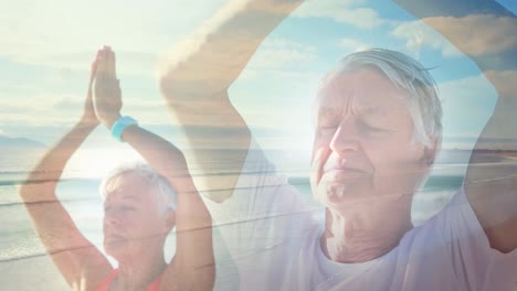 animación de luz brillante sobre una pareja de ancianos practicando yoga en la orilla del mar