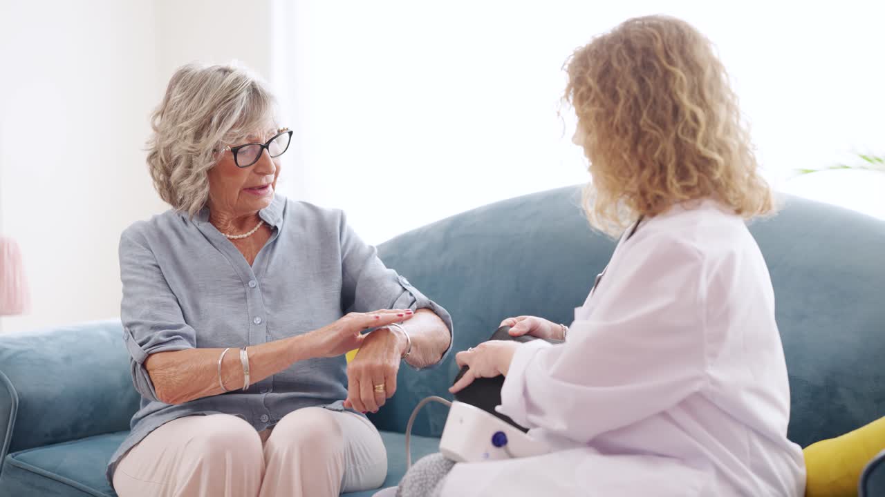 Doctor Checking Blood Pressure of Elderly Patient