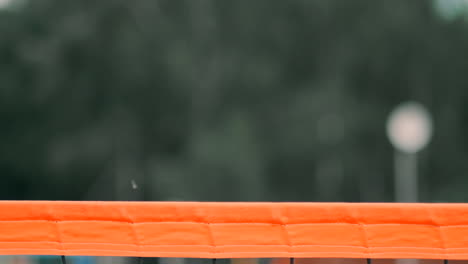 Women-Competing-in-a-Professional-Beach-Volleyball-Tournament.-A-defender-attempts-to-stop-a-shot-during-the-2-women-international-professional-beach-volleyball.