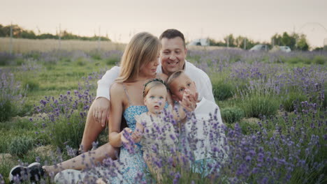 portrait of a young family on a lavender field.