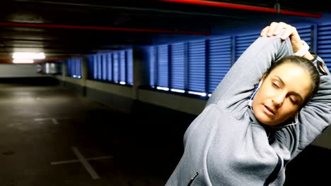 woman exercising at underground car parking lot 4k
