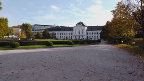 Presidential-Palace-in-Bratislava,-Slovakia-on-Sunny-Autumn-Day,-Garden-View-of-Building-and-City-Landmark