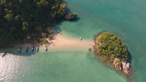 4K-aerial-drone-footage-of-flight-over-the-Thai-beach-and-rocks,-Thailand,-Asia,-Andaman-sea,-Pakbia-Island,-Longtail-boats