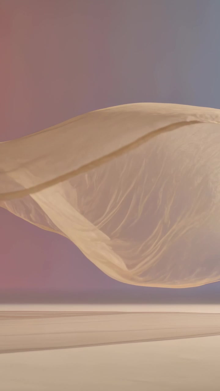 Vertical video: Billowing beige fabric sheet arcing above pale floor in studio, driven by fan