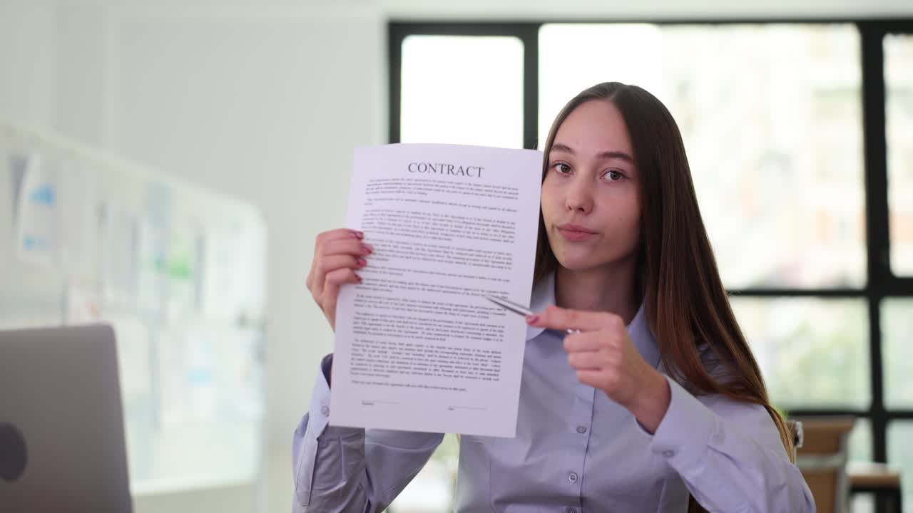 Woman pointing at a contract document