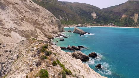 Cliffside-view-of-Petani-Beach-with-turquoise-waters-in-Kefalonia,-Greece