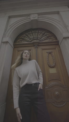 woman in front of an old building