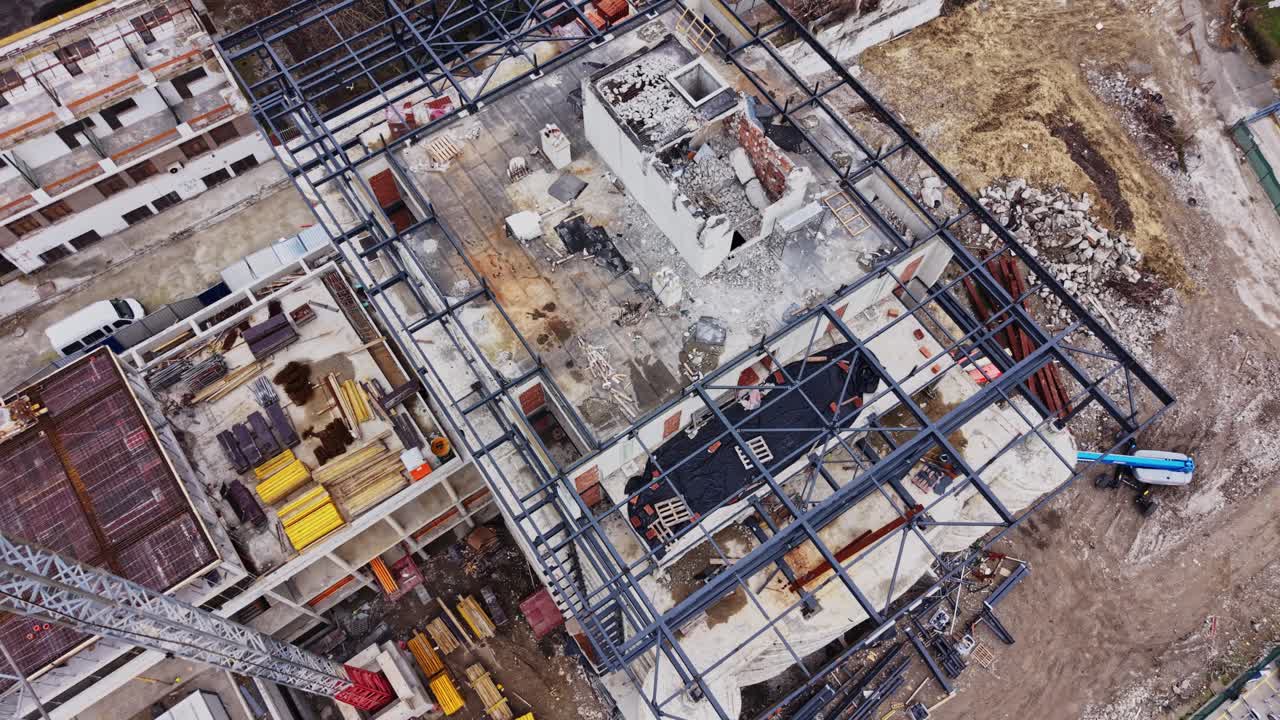 Construction site shows building structure in progress on a clear day