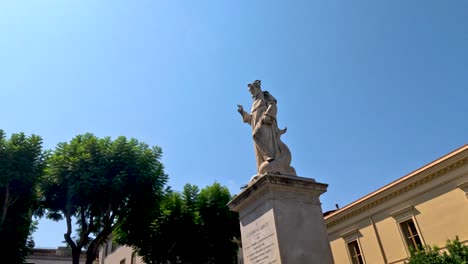 tourists and locals around a historic statue