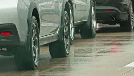 car moving and stopping in traffic jam on rainy american highway