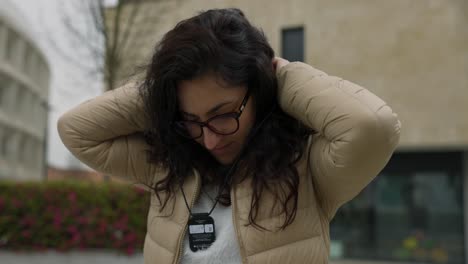 woman with curly hair wearing magnetic mount of mology magic camera