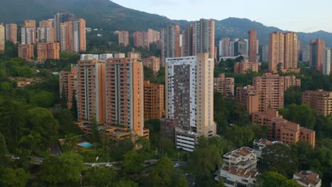 low aerial shot flying above apartment buildings in colombian city