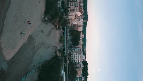 vertical dronie over a little coast village on the mediterranean sea, arenys de mar, maresme, catalunya, spain