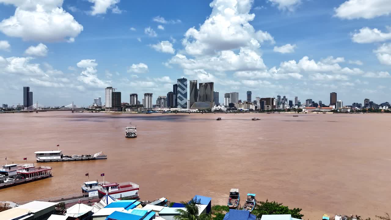 Aerial drone hyperlapse footage above the Mekong river, crossing point from Areyksatr to Phnom Penh, capital city of Cambodia
